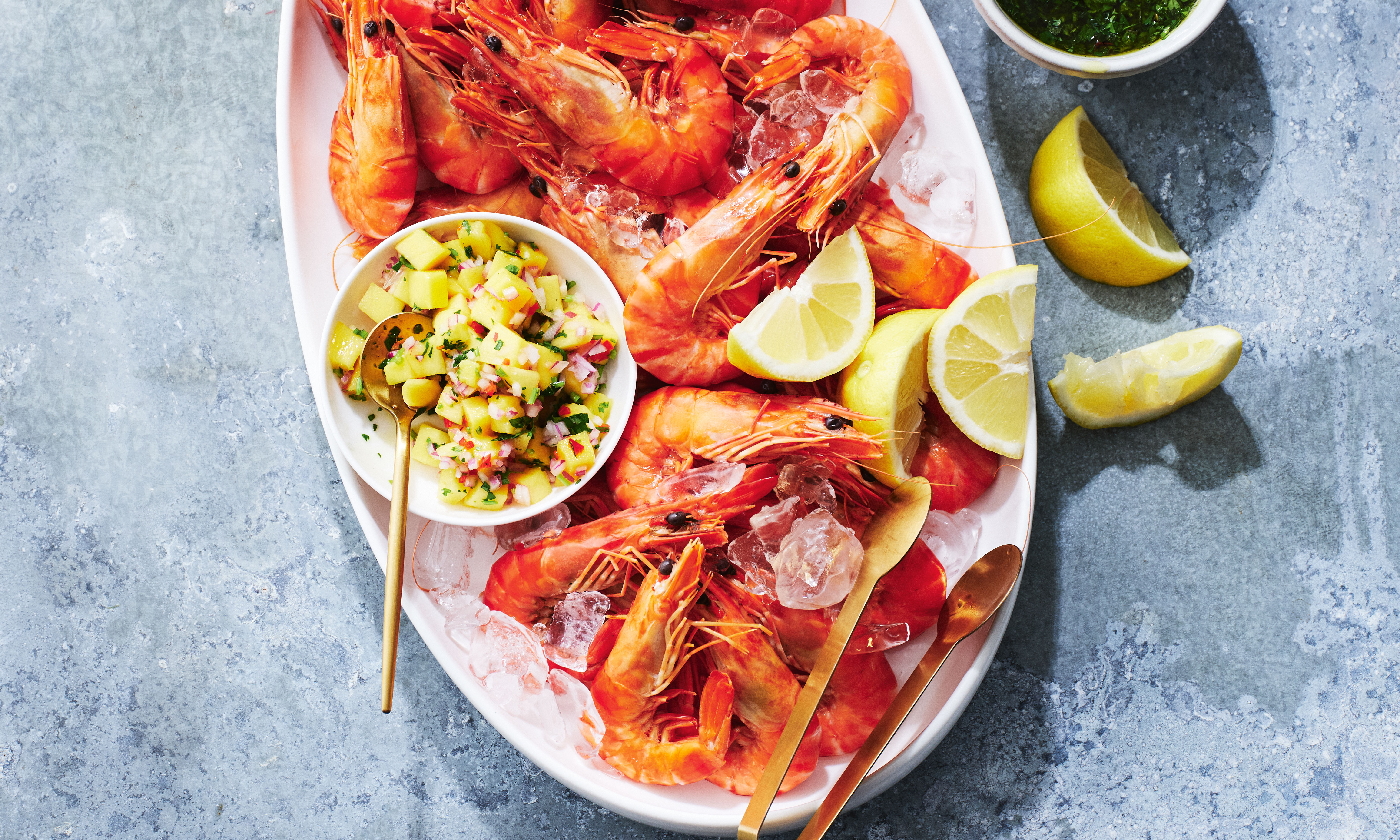 Prawns on a platter with sauces