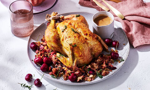 Roast chicken with cherry and prosciutto stuffing