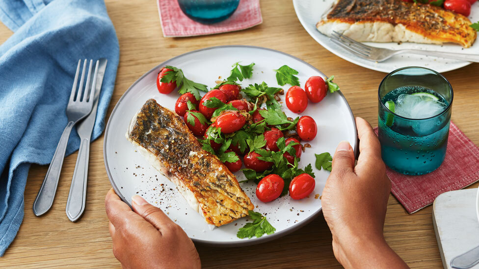 Crispy skin barramundi with warm cherry tomato salad