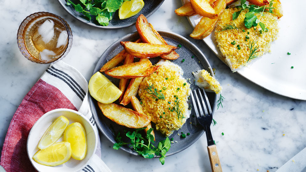 crumbed barra with chips and tahini-herb dressing