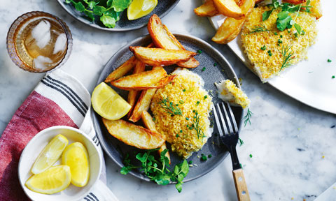 Curtis Stone’s crumbed barra with chips and tahini-herb dressing