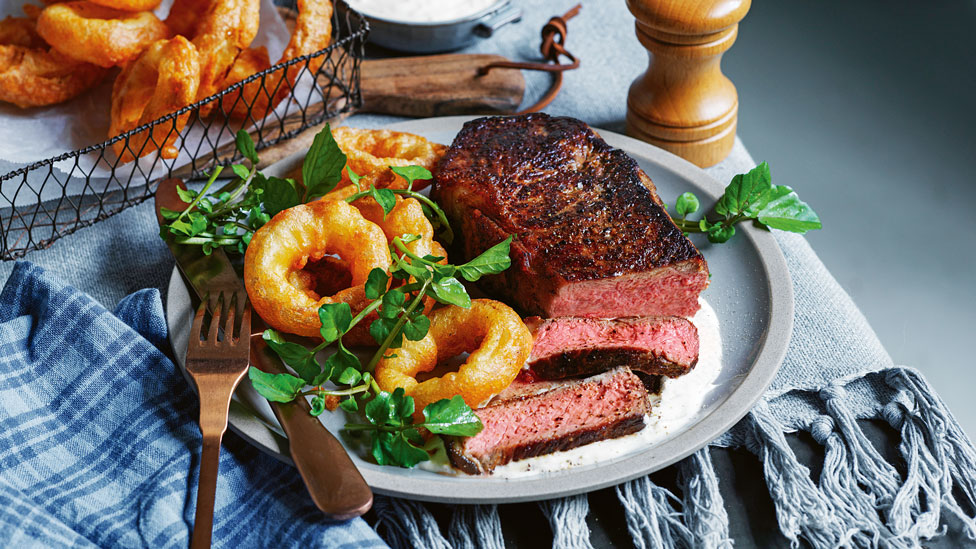 Curtis Stone’s pan-seared steak with beer-battered onion rings