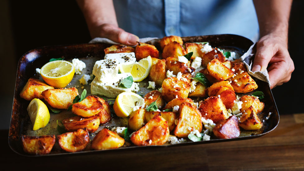 Roast potatoes with oregano, fetta and lemon