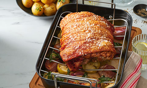 Courtney Roulston’s crispy roast pork with apple, onion and mustard gravy