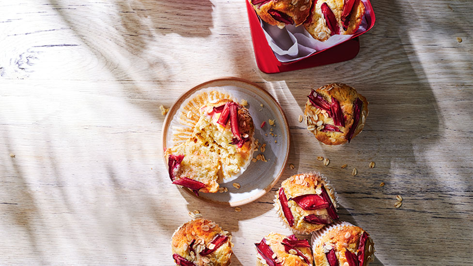 Rhubarb and pear muffins plated on a table