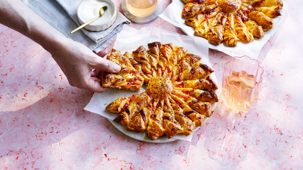 Tomato and fetta tart soleil on a white plate