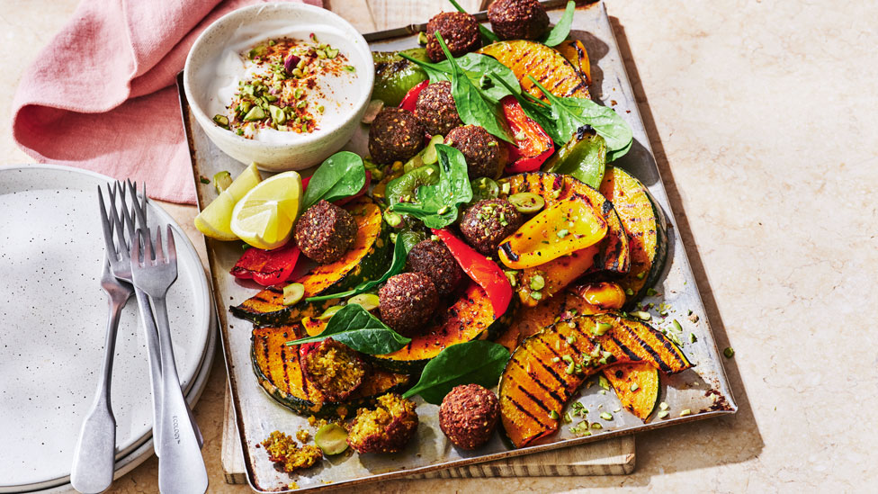 Vegan pumpkin and falafel salad with harissa dressing
