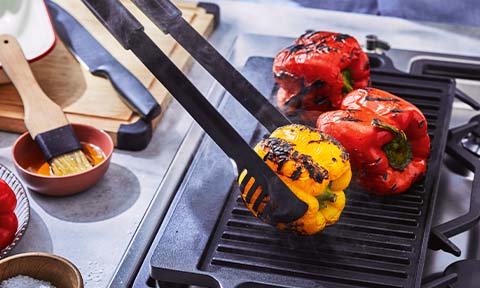Capsicum being charred on a BBQ.