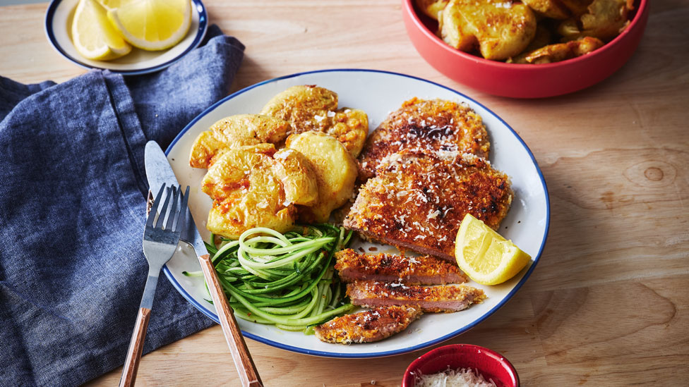 Crusted sizzle steaks with crispy potatoes and zucchini