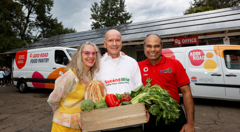 Second bite and Coles team with produce box in front of Addi Road vans