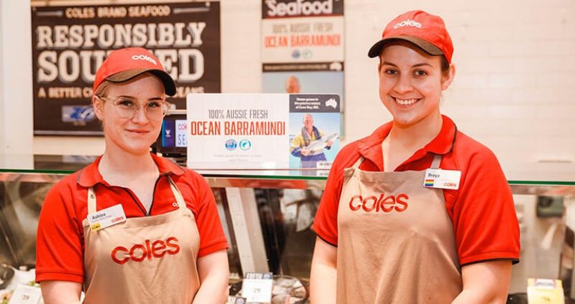 Two Coles employees in store