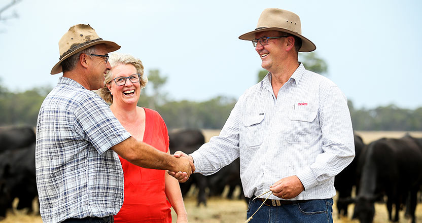 Coles southern livestock manager, Stephen Rennie, with Gippsland cattle producers Trevor and Carryn Caithness
