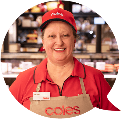 Coles employee in uniform smiling at camera