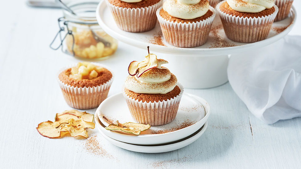 Apple pie cupcakes with apple chips and ground cinnamon