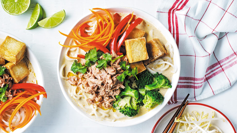 Chilli tuna laksa with lime wedges