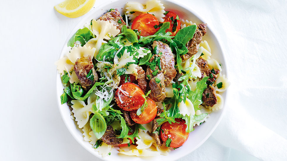 Lamb and lemon pasta with tomatoes and baby rocket