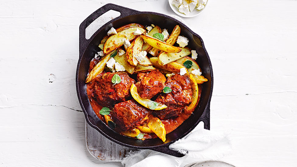 Greeky style pork with roast potatoes, topped with lemon