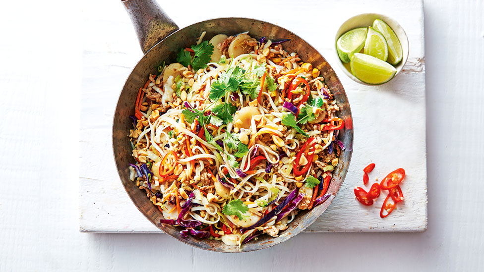 A bowl of chilli pork stir fry with noodles