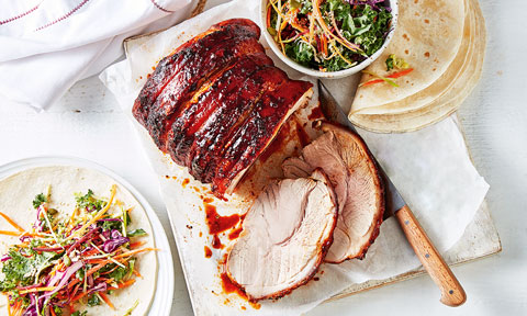 A cut of smoky bbq pork with a bourbon glaze