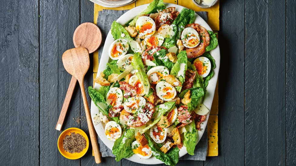 Caesar salad with soft-boiled eggs