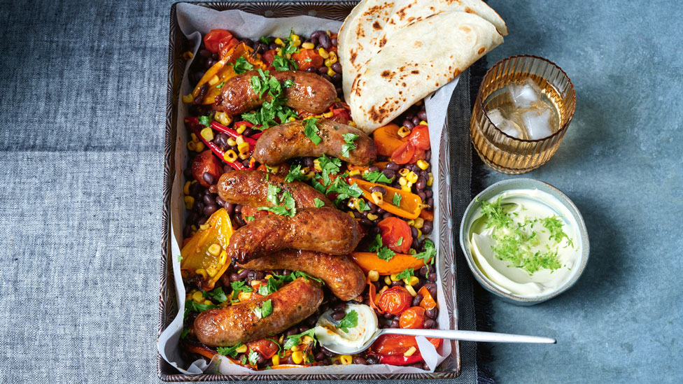 Tex-Mex sausage tray bake with lime sour cream