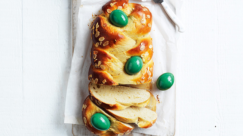 Greek easter bread with 4 dyed eggs on top