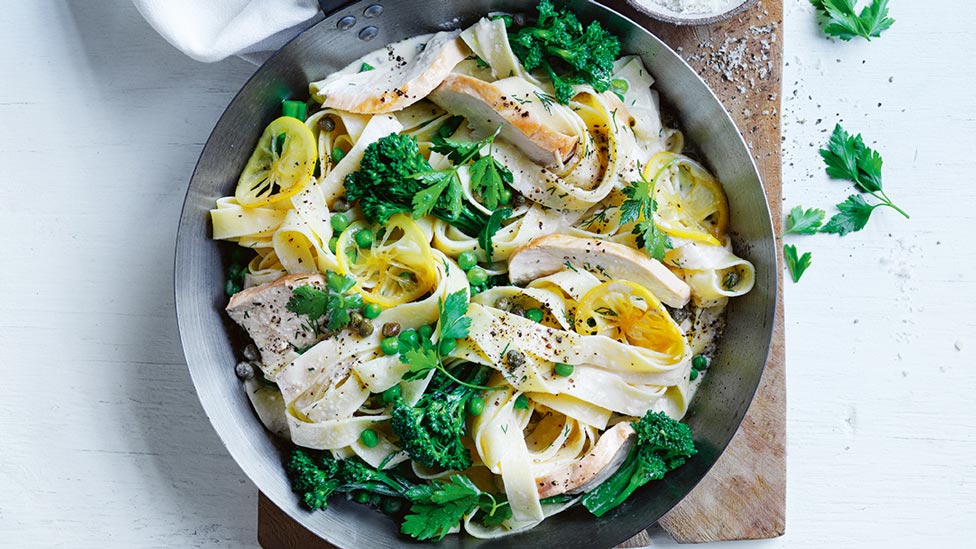 A bowl of creamy chicken and lemon fettuccine