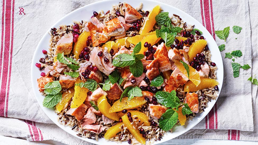 Rice and salmon salad with chopped mint on top