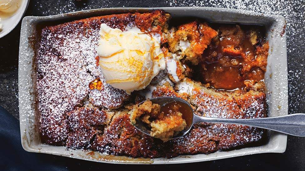 Banana and malt self-saucing pudding with an ice cream ball