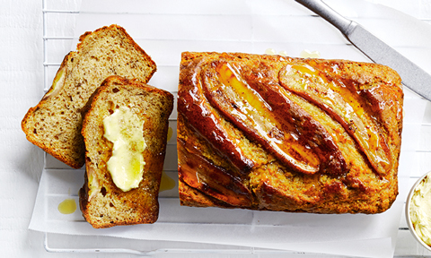 Classic banana bread loaf served with butter on the side