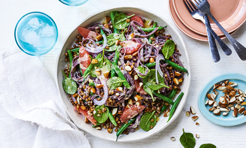 Black noodle salad with lentils and pink grapefruit with crushed almonds on the side