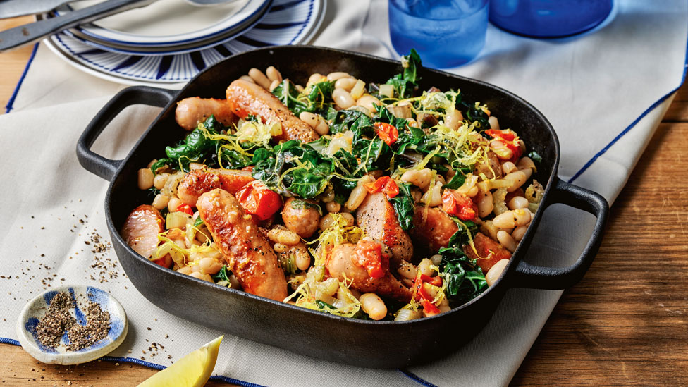 One-pan pork sausages with silverbeet and tomato