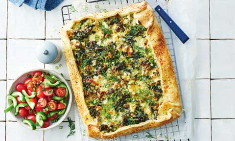 Greens and cheese pie with a salad bowl