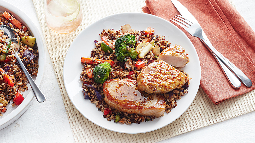 Apple cider-glazed pork with quinoa fried rice