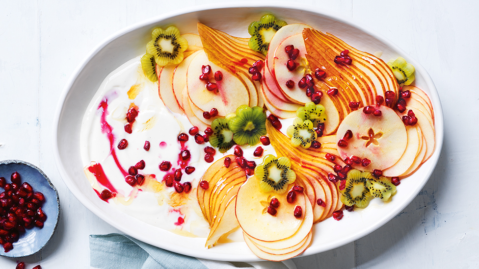 Yoghurt and sliced fruit in a bowl