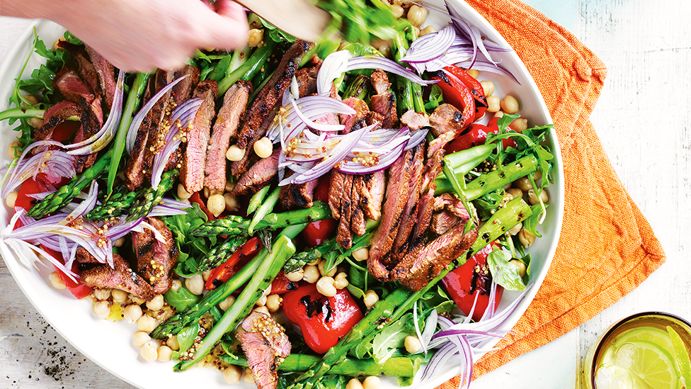 Barbecued steak with asparagus, baby capsicum and rocket