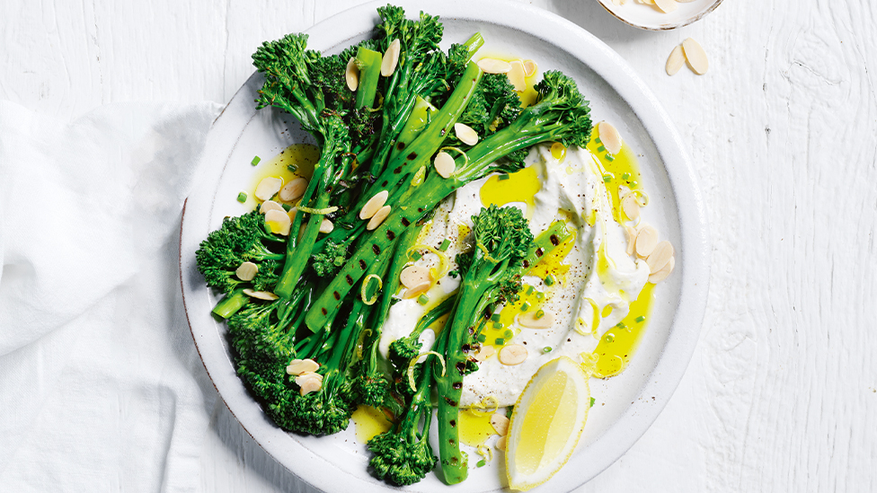Barbecued baby broccoli served with a blue cheese creme fraiche, sprinkled with flaked almonds