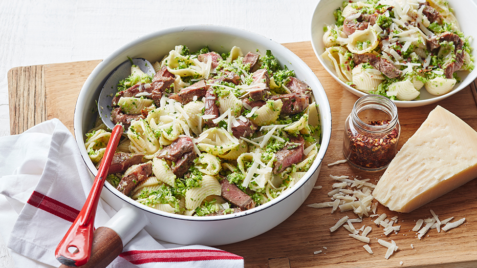 Beef pasta with broccoli pesto in a serving bowl