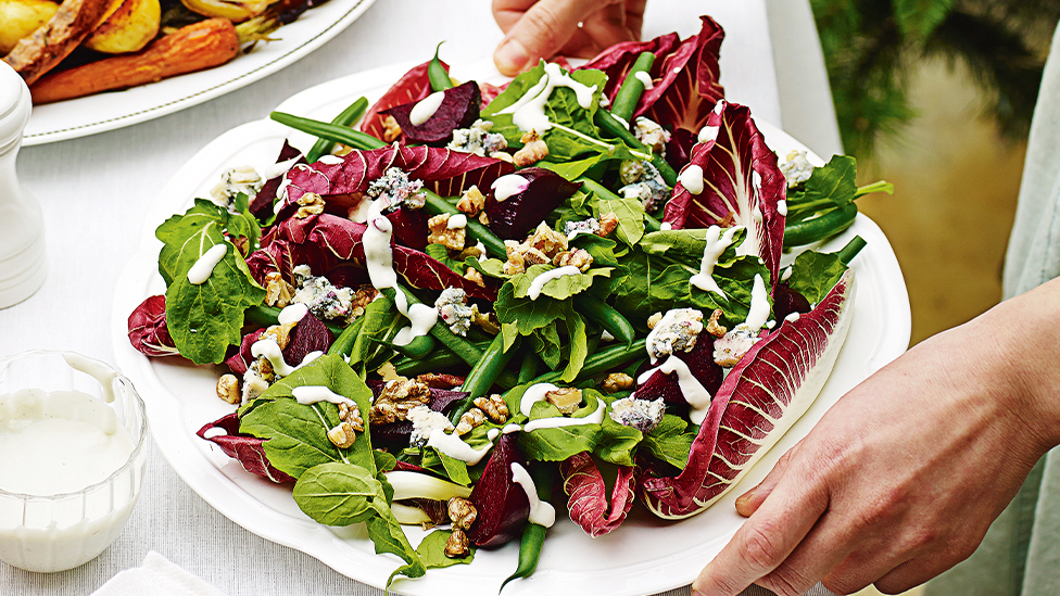Beetroot and rocket salad with gorgonzola dressing on a serving plate