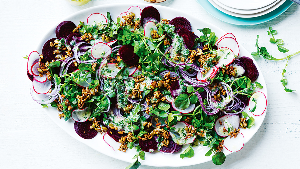 Salad of beetroot, watercress and radish on a serving plate
