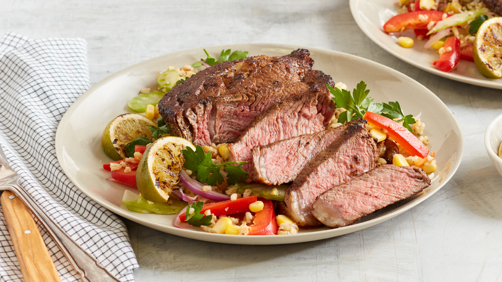 Cajun steaks with corn and rice salad