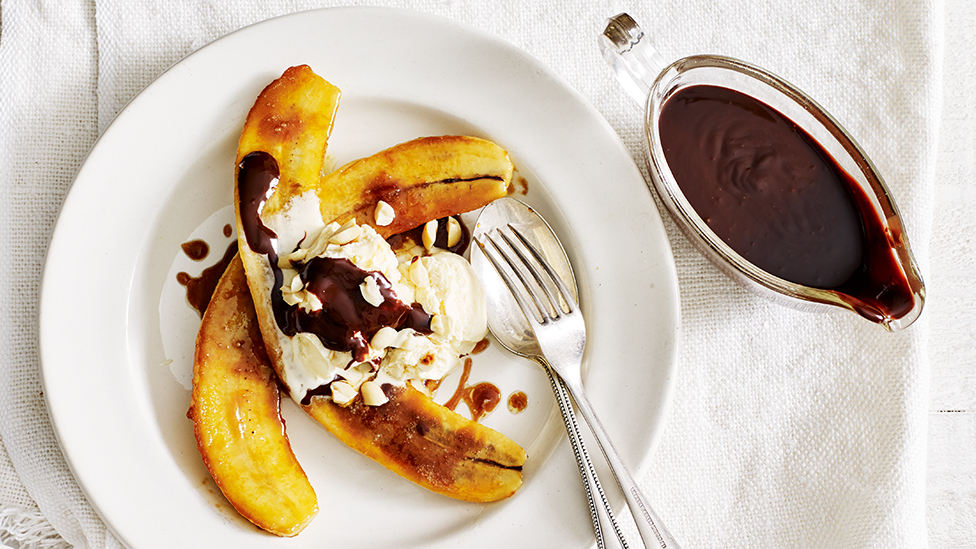 Caramelised banana split with salted caramel ice-cream and warm dark chocolate sauce