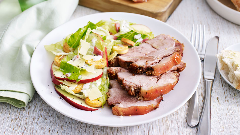 Caraway and mustard roast pork with apple caesar salad