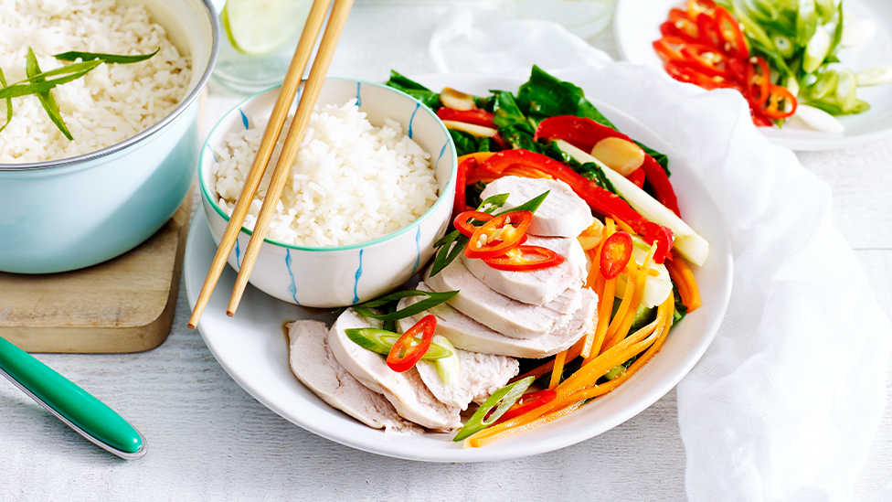 Coconut poached chicken on stir-fried Asian vegetables