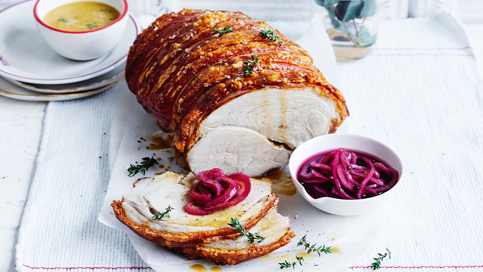 Crackling pork roast with pickled onions and cider jus