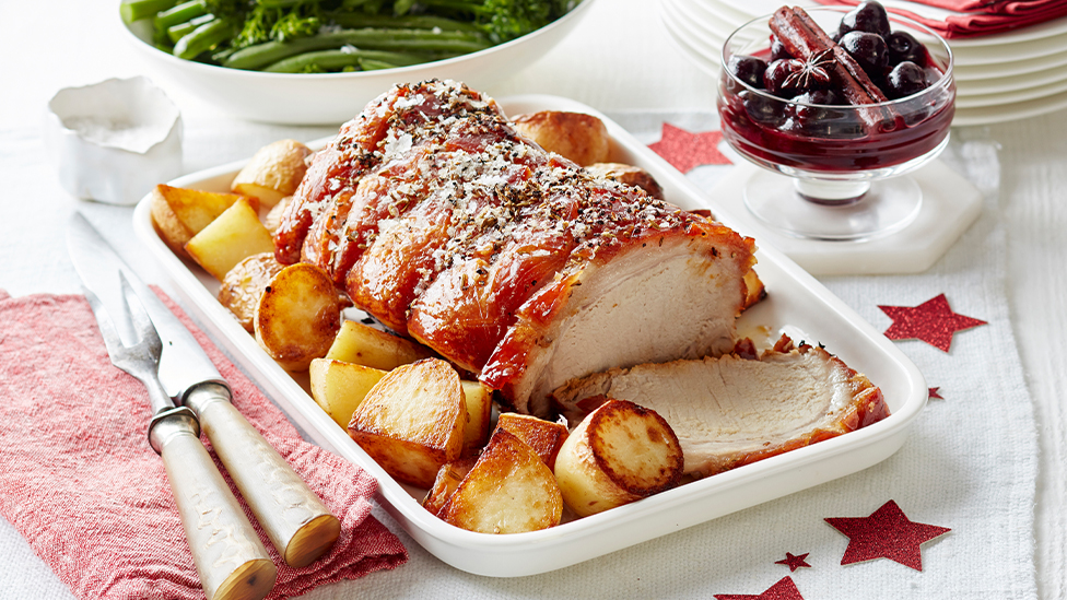 Crispy Christmas roast pork with spiced cherry port sauce