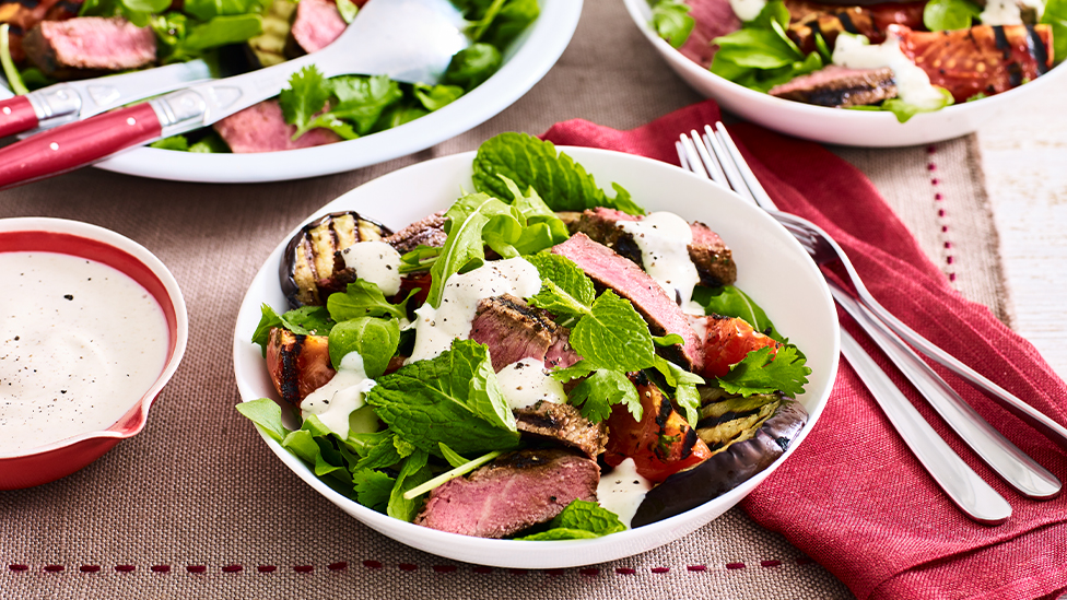 Cumin and paprika spiced beef with eggplant and tomato salad