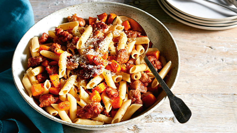Curtis Stone's Penne pasta with pan-roasted butternut pumpkin and pork sausages