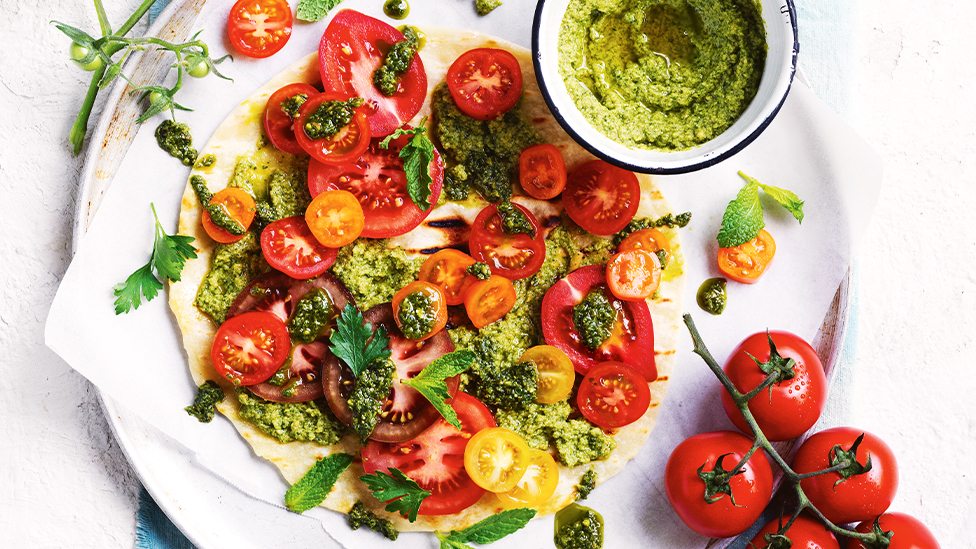 Flatbreads with green olive paste and mixed tomatoes