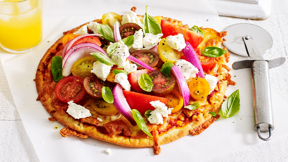 Fresh tomato and goats cheese pizza